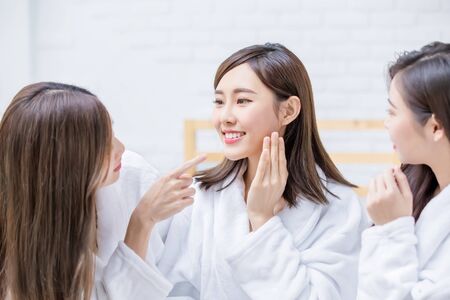 asian women friend are talking about thier healthy skin and teethの写真素材