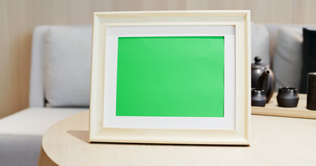 close up of photo frame with green copys space on table at homeの写真素材