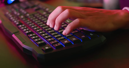 close up of cyber sport gamer play game with keyboard and mouse