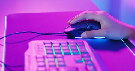 close up of cyber sport gamer play game and click the mouseの写真素材