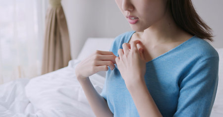asian beauty woman has dry skin and scratching her chest