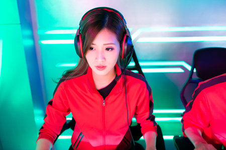 asian teenage cyber sport gamers play in multiplayer PC video game on eSport tournamentの写真素材