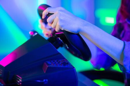 Close Up of Young Asian Pro Gamer Girl Play Car Racing Online Video Gameの写真素材