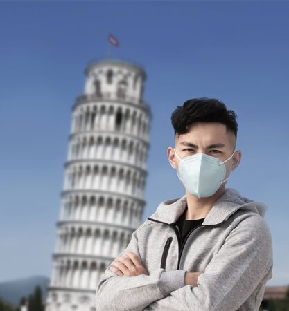 asian man wears protective n95 mask against transmissible infectious diseases in Italyの写真素材