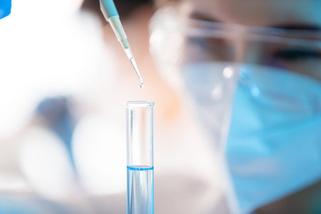 scientist use test tube filling with liquid in the laboratory