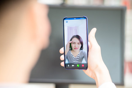 Telemedicine concept - asian female patient consult her health condition to male doctor by talking...