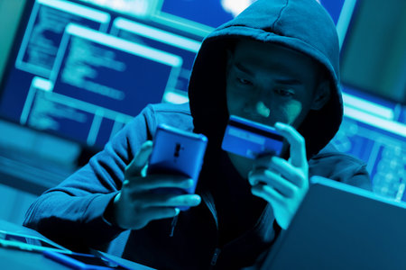 Asian male hacker fraudulently use credit card for payment