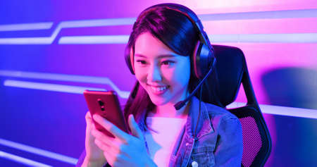 Young asian esport gamer girl feel painful while playing in Online Video Game because her shoulder is tiredの素材 [FY310154251287]