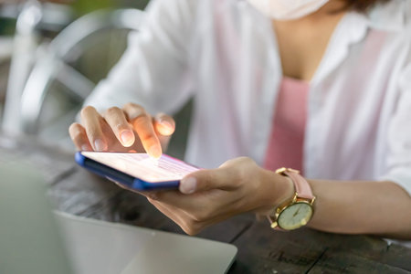 close up of asian young woman use 5g smartphone outdoor