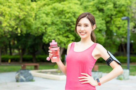 sport woman injury her knee while running in th parkの写真素材