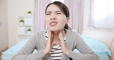 Asian businesswoman use laptop and phone to work in the parkの写真素材