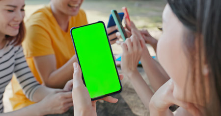 close up of happy young asian teenagers share an interesting APP on smartphone and they feel very...