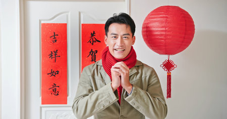 asian man greeting happy chinese new year with word meaning wish you good fortune and may all your...