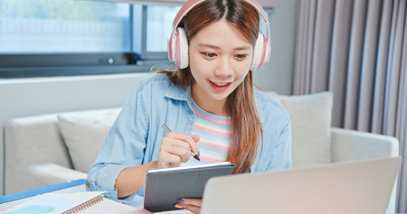 close up of asian college female student is learning and looking online course through laptop with...