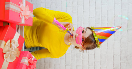 asian female blogger live steaming and celebrating her birthday day with many giftsの写真素材