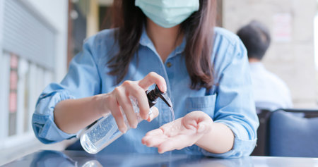 close up of asian woman use hand sanitizer gel for hygiene bacteria and virus protection before...