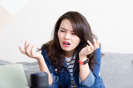 Smart AI speaker concept-Asian woman tell voice assistant to control smarthome but it has mistake