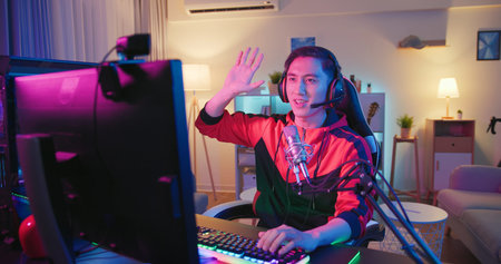 Young Asian Pro Gamer have live stream with fans happily at home