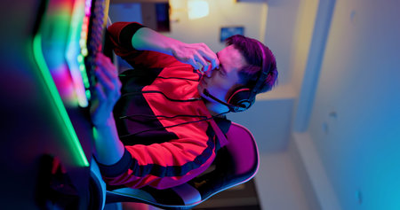 Young asian esport gamer feel painful while playing in Online Video Game because his eye is tired