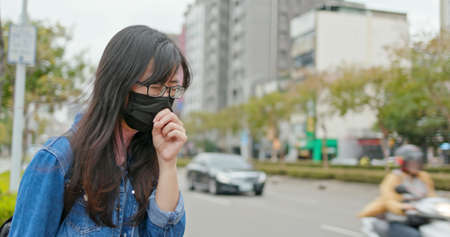 asian woman feel sick and cough outdoorの写真素材