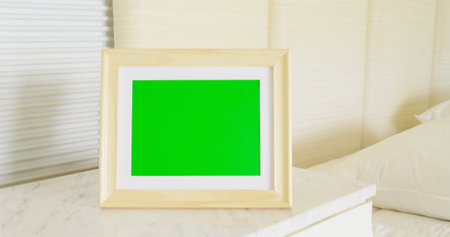 close up of photo frame with green copy space on table at homeの写真素材