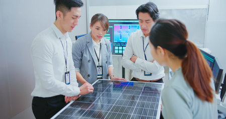 asian engineer team have meeting and discussing solar panel projects in officeの写真素材