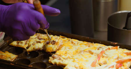 Close up of cooking octopus balls at night marketの写真素材
