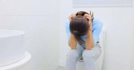 asian woman feel depression in the toilet room at homeの写真素材