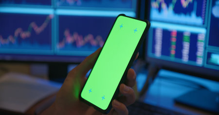 close up of asian man has stock market or cryptocurrency investment from home by computer with green...
