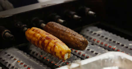 popular taiwanese snack - close up of roasted corn at night marketの写真素材