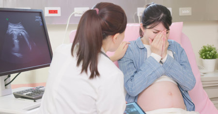 Pregnant woman feels sad when getting some bad news that her baby gets sick or intrauterine fetal...