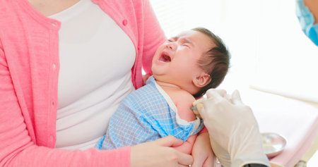 authentic shot of asian mother and infant in pediatrics clinic - doctor wearing face mask inject...