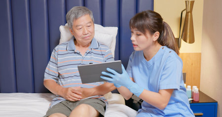 people home healthcare concept - asian female nursing assistant is using stethoscope to examine...