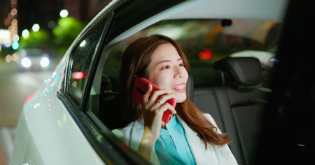Pretty asian girl relaxing with hydro massage at luxury pool - young woman getting hydrotherapy in pool at spa hotelの写真素材