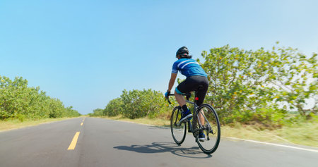 close up of asian man ride a bicycle on countryside happilyの写真素材