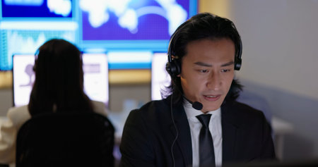 Asian customer service operator helps solving problem with phone call