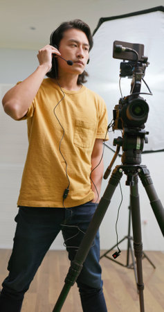 Asian Videographer with confident while video tappingの写真素材