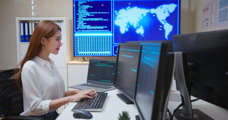 asian female confident software engineer or programmer in information technology department is...