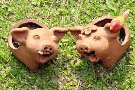 Pork with clay sculpture birdの写真素材