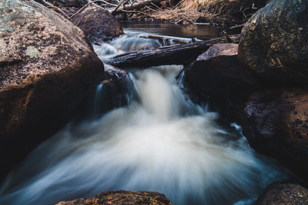 River flowing through large boulders.