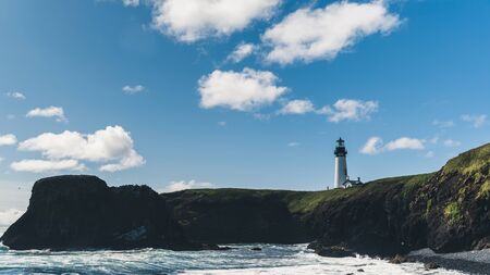A lighthouse overlooking the ocean.の写真素材