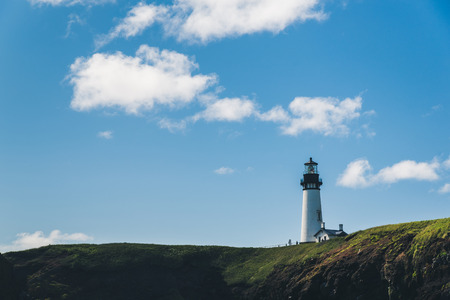 A lighthouse overlooking the ocean.の写真素材
