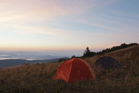 Two tents at early morning in mountainsの写真素材