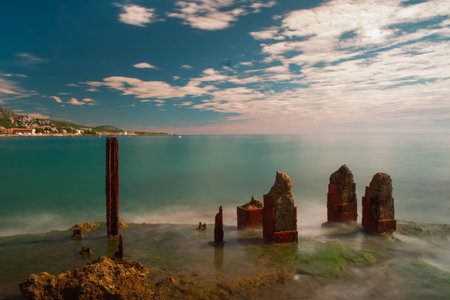 Seaside city in distance at coastの写真素材