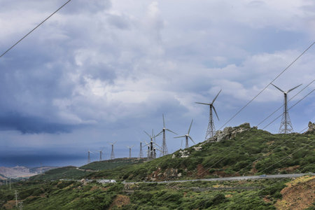 The shore of the Strait, the wind farms.
