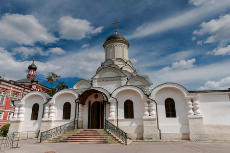 Dome of the Cathedral and belltower on background of clouds.