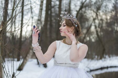 Young emotional woman making selfie on the street.の写真素材