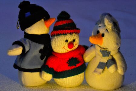 Symbol of winter represented by three happy snowmen.の写真素材