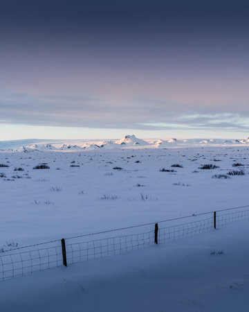 Beautiful sunset over the winter Iceland. Scandinavian landscape and gorgeous Icelandic scenery in the winter time. Tourism in Iceland leads you to visit this awesome place all years long.の写真素材