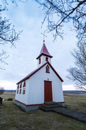 Typical red colored wooden church in Fludir town in south Iceland within the Golden Circle. Sunset light stock pictureの写真素材